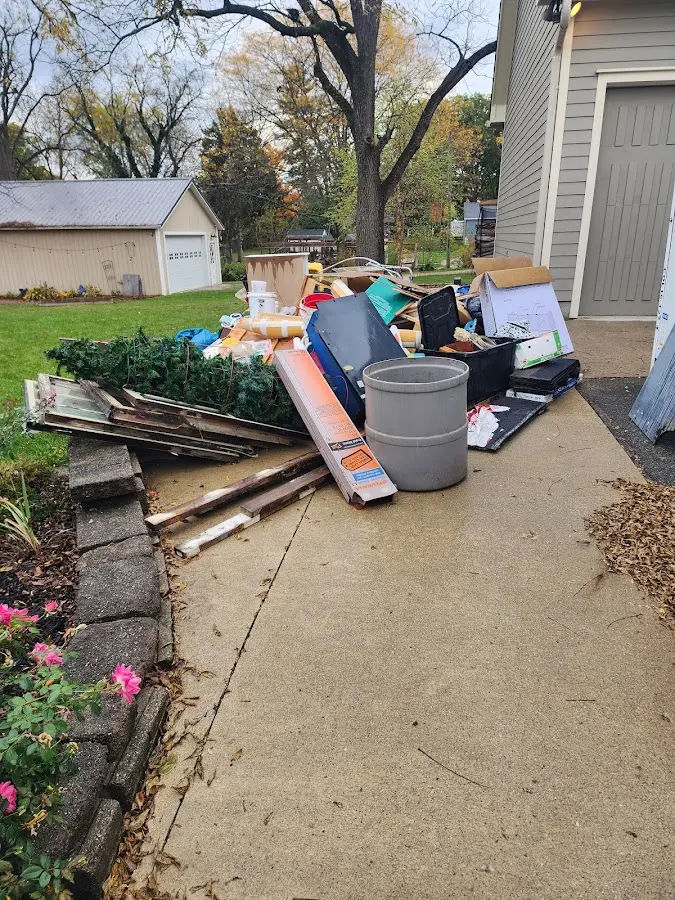 Dumpster being loaded with debris for Commercial Dumpster Rental in Attalla